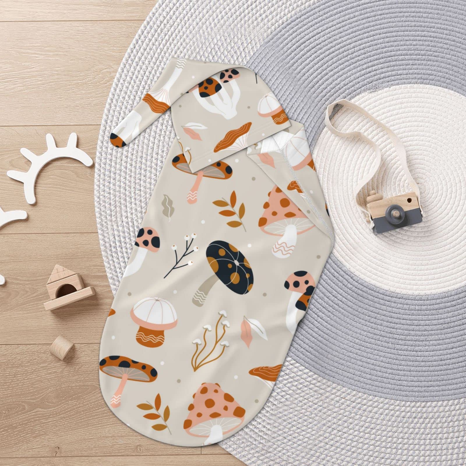 Jarverce mushroom swaddle used as photography prop for cute newborn shots