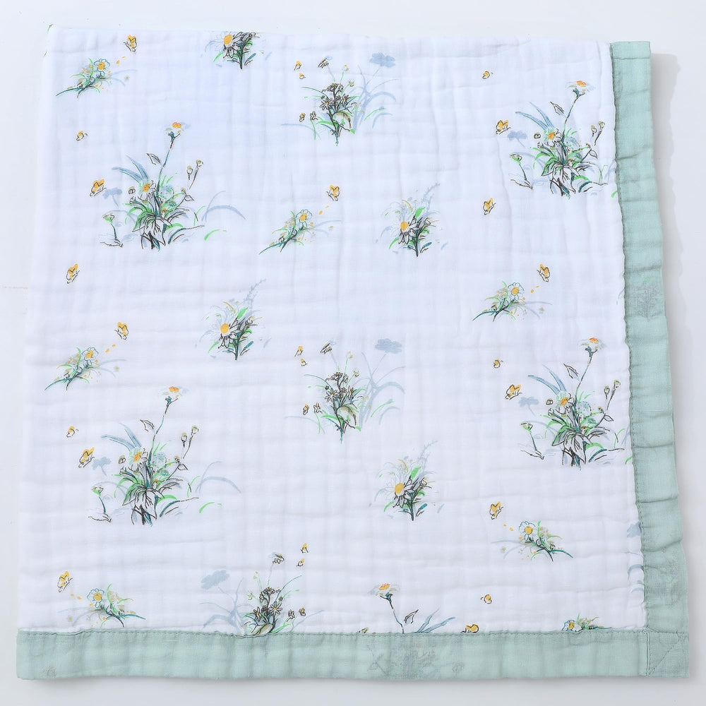Jay & Ava Soft Cotton Muslin Blanket folded for easy warmth and breathability