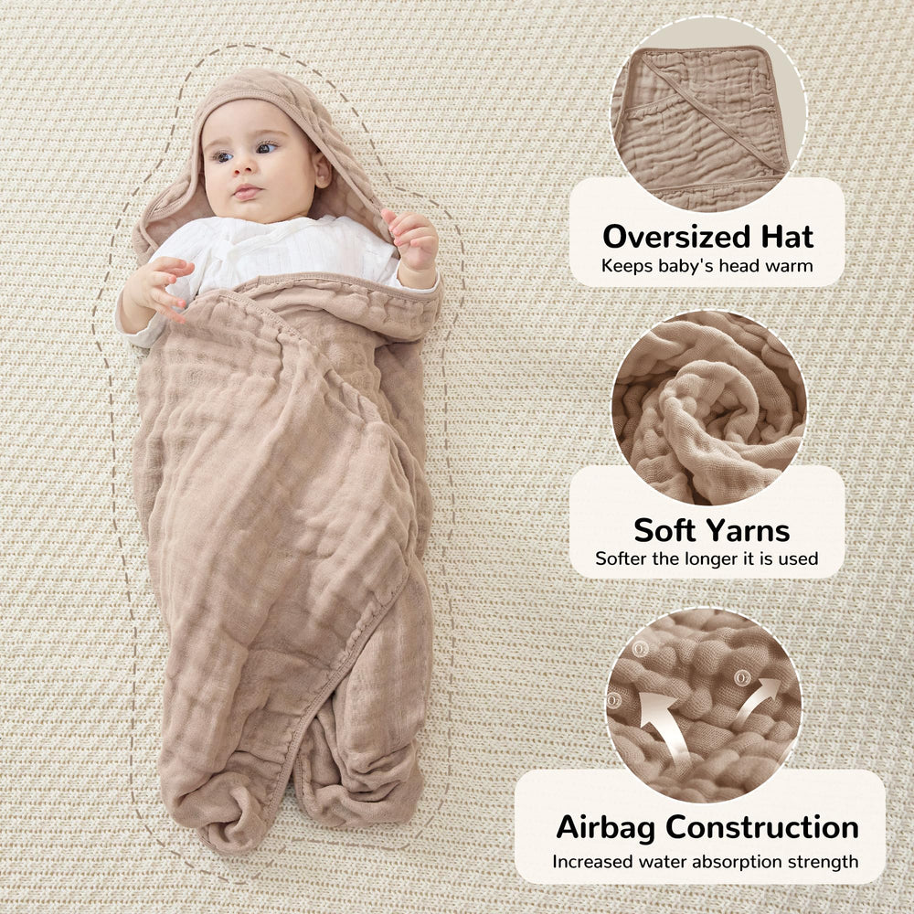 Baby wrapped in Jellymoni hooded towel, warm and cozy