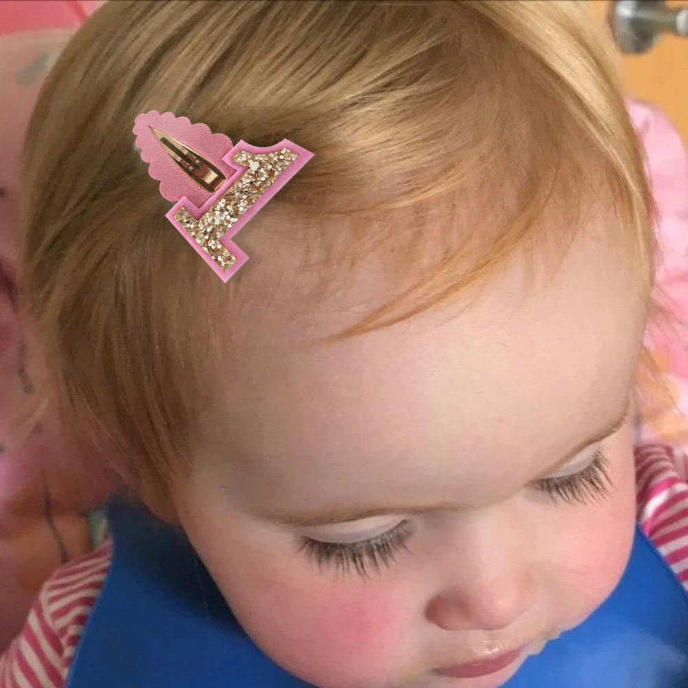 Jissoo baby girl party accessory worn in hair for easy styling.