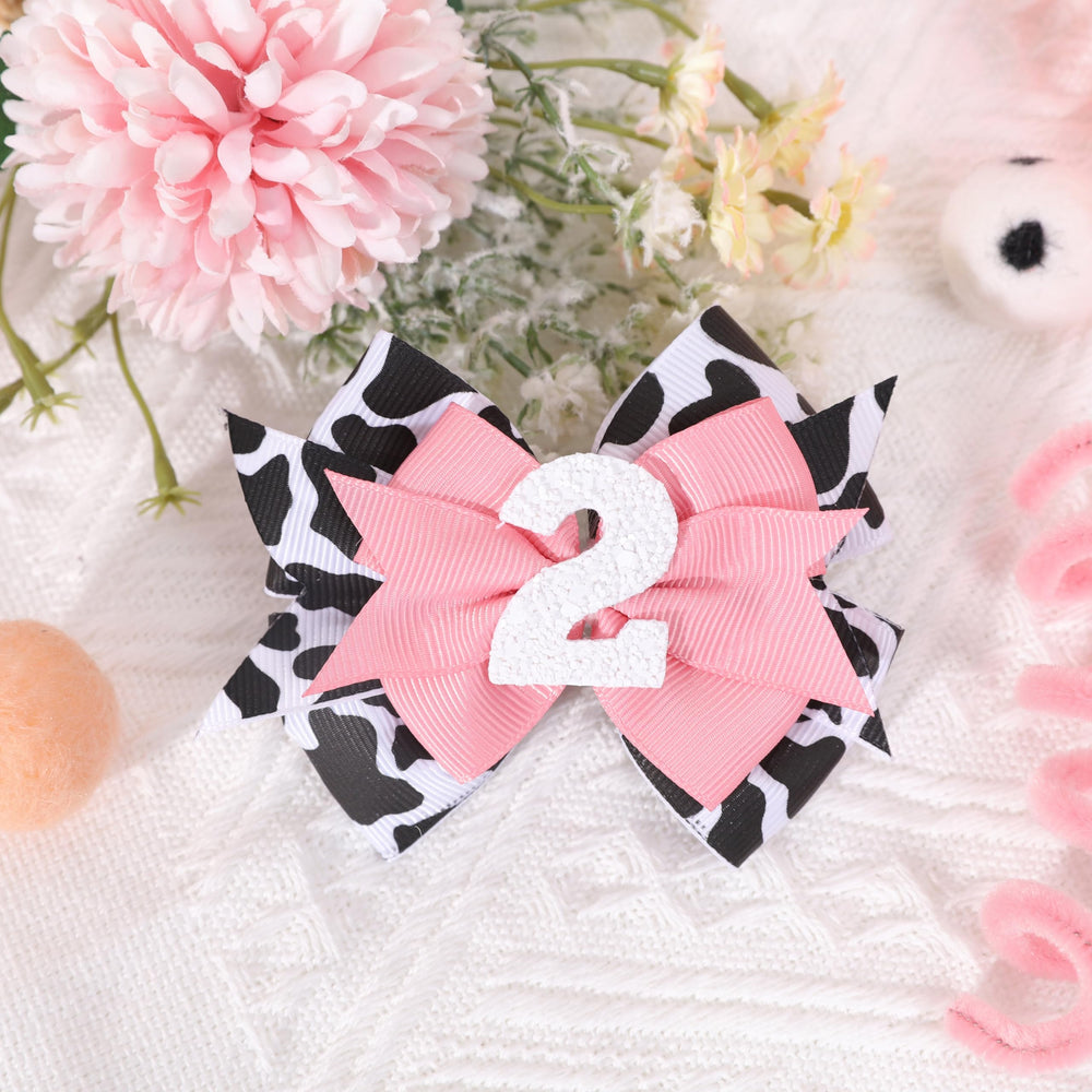 Jissoo cow print bow headband pink ideal for birthday shoots