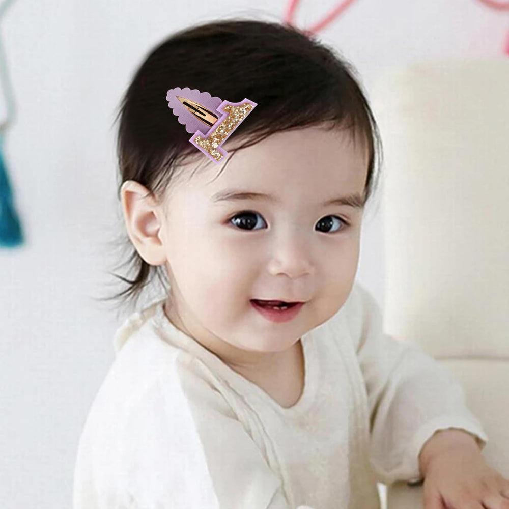 Jissoo pink-purple hair clip worn on baby hair for easy styling.