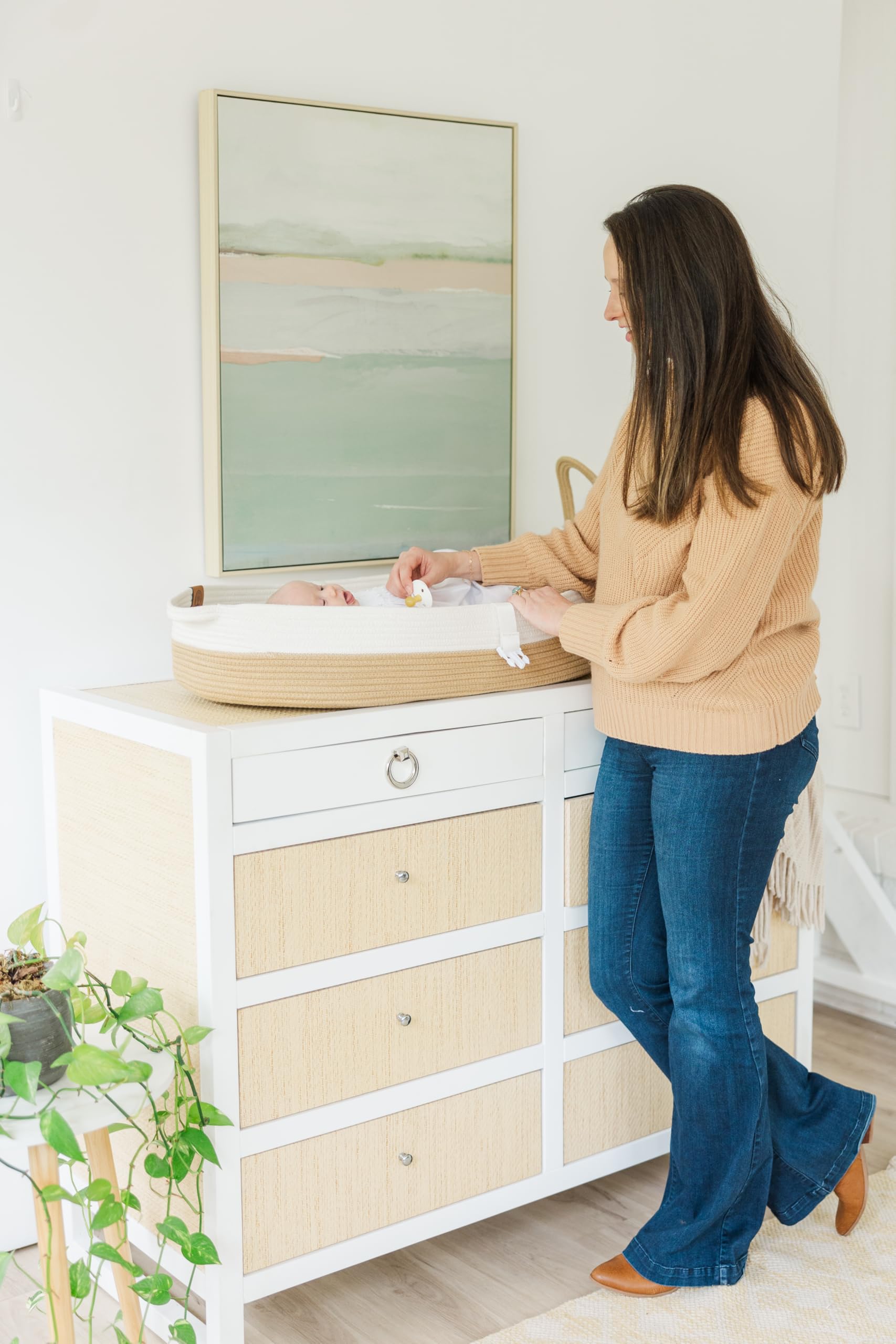 JJOO changing basket used as photography prop in nursery.