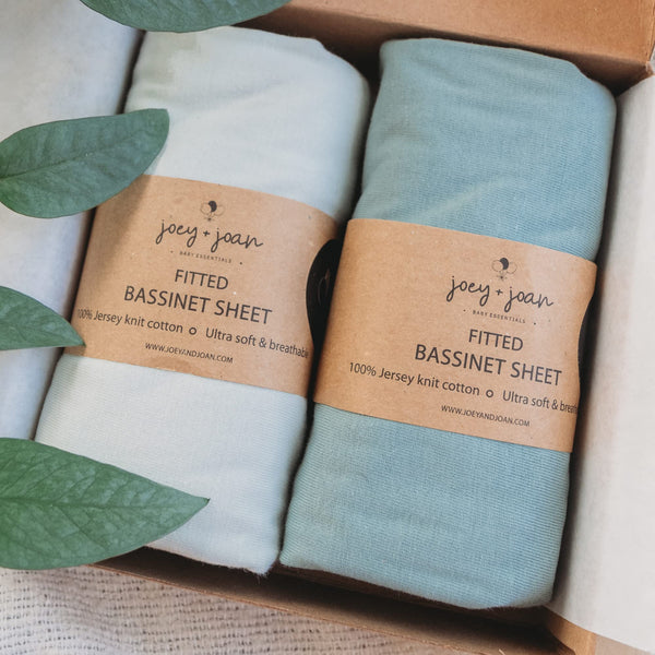 Joey + Joan bassinet sheets in light sage jersey offer a soft, breathable surface