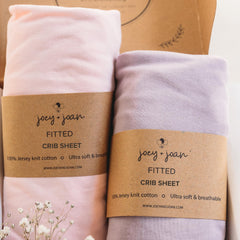 Joey + Joan fitted crib sheet 28x52 shows ultra-soft jersey cotton for cozy nights.