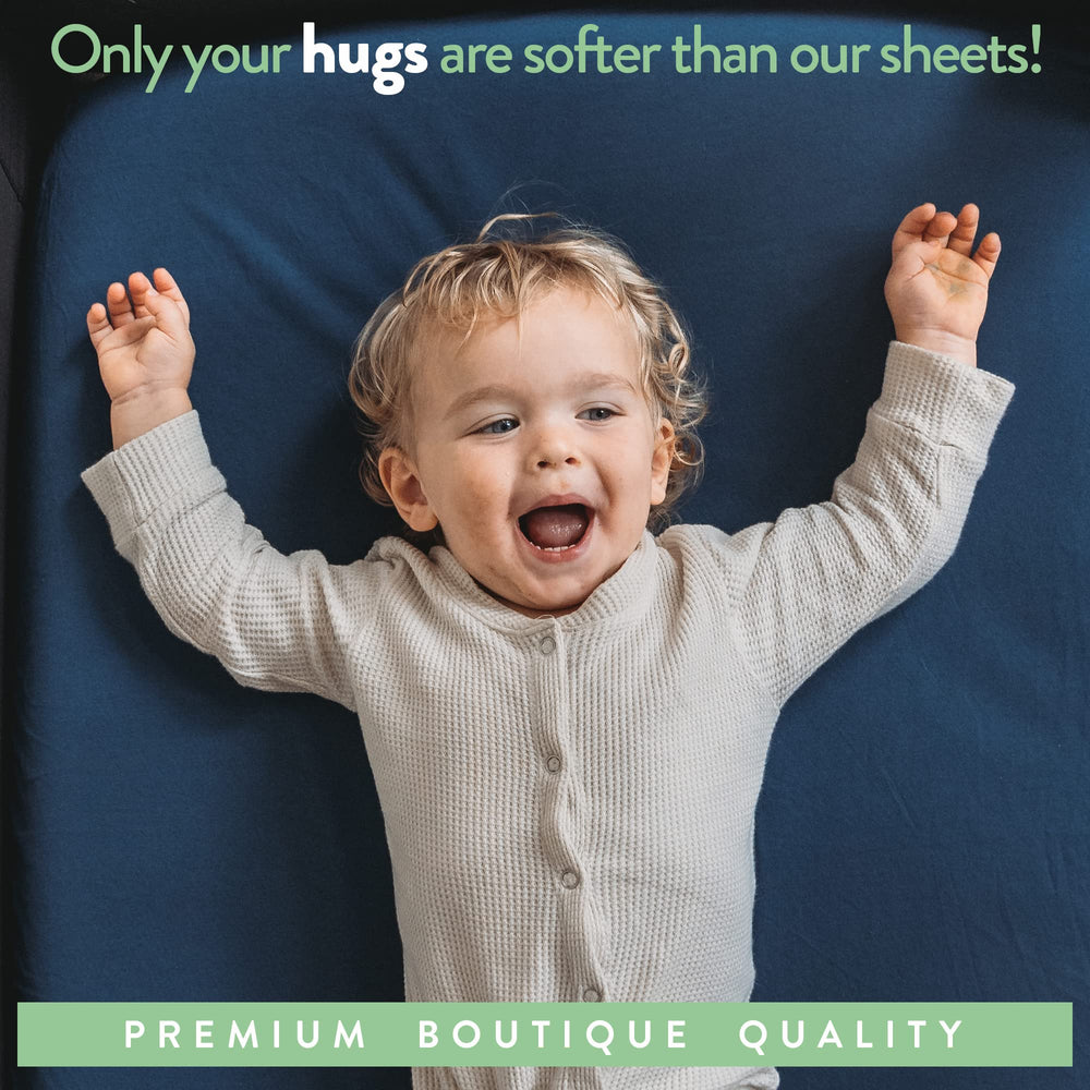 Joey + Joan mini crib sheets breathable fabric keeps baby comfy overnight.