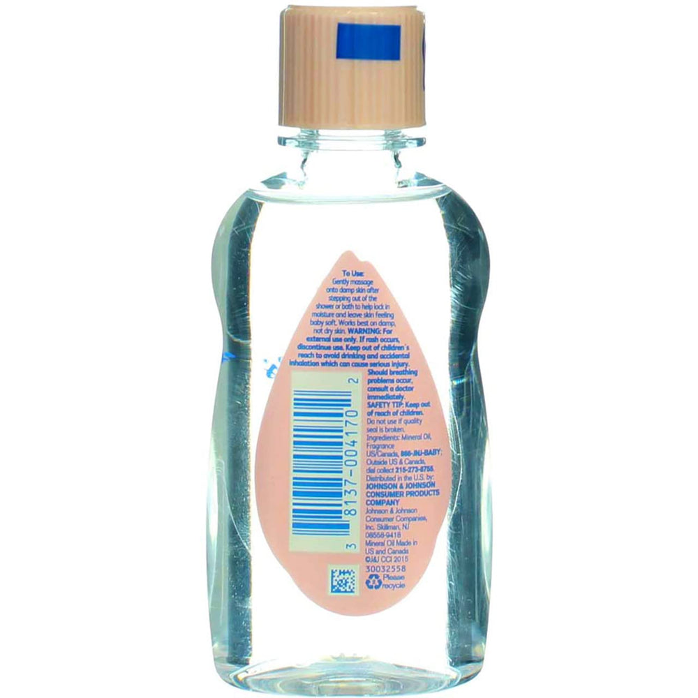 Johnson & Johnson Baby Oil used for baby massage during calm routine.
