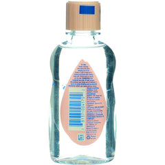 Johnson & Johnson Baby Oil used for baby massage during calm routine.