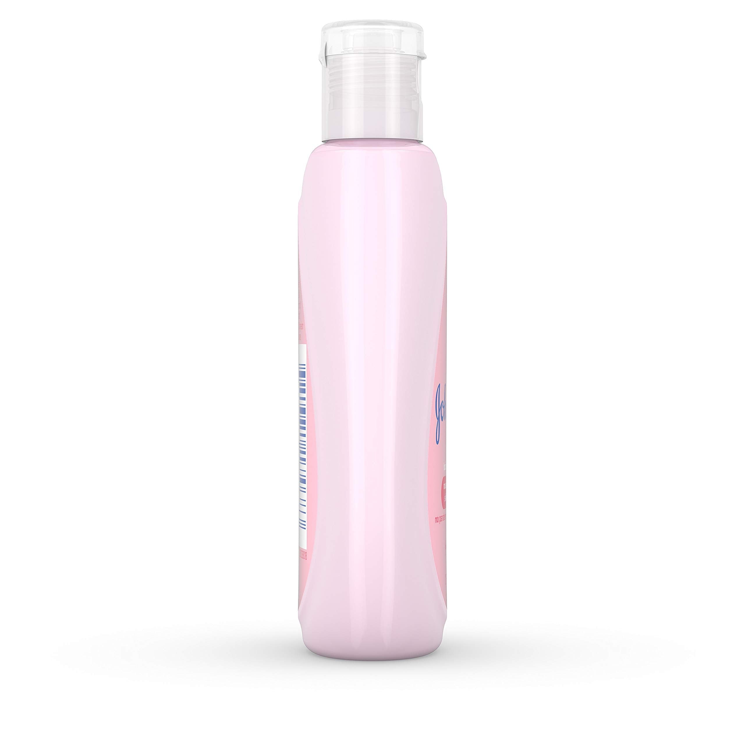 Johnson's Baby Lotion dispensed on hand shows smooth, quick absorption.