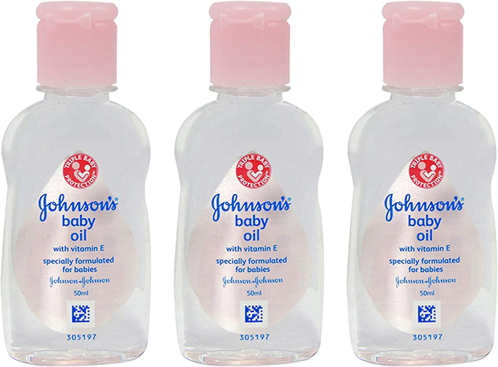 Johnson's Baby Massage Oil 50ml bottle pour for gentle baby massage routines.
