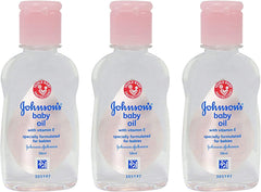 Johnson's Baby Massage Oil 50ml bottle pour for gentle baby massage routines.