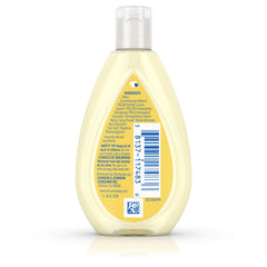 Johnson's Head-to-Toe Tearless Baby Wash foam demonstrates tear-free lather near baby's eyes