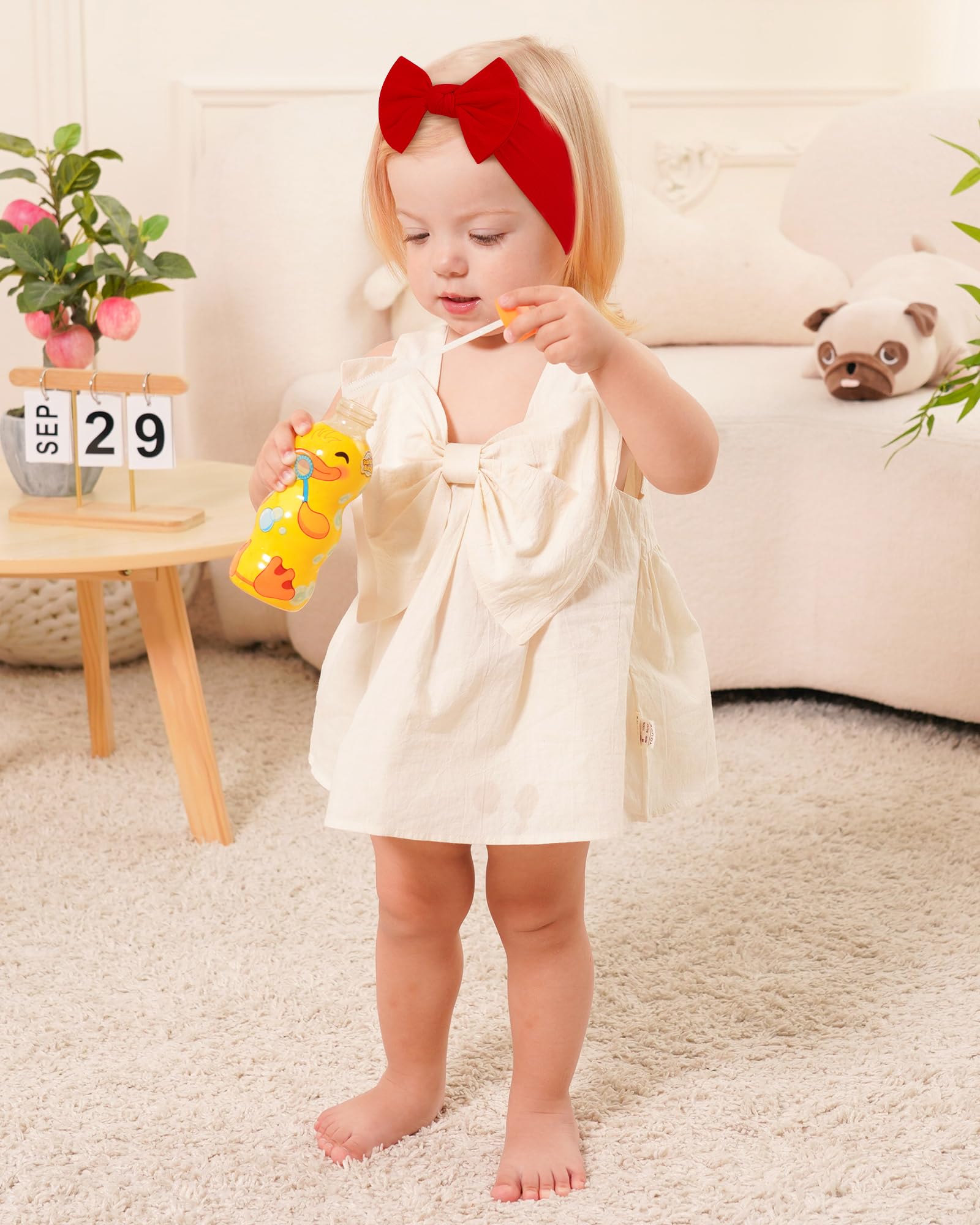 Jollybows baby headband worn during photos enhances cute, secure holiday looks