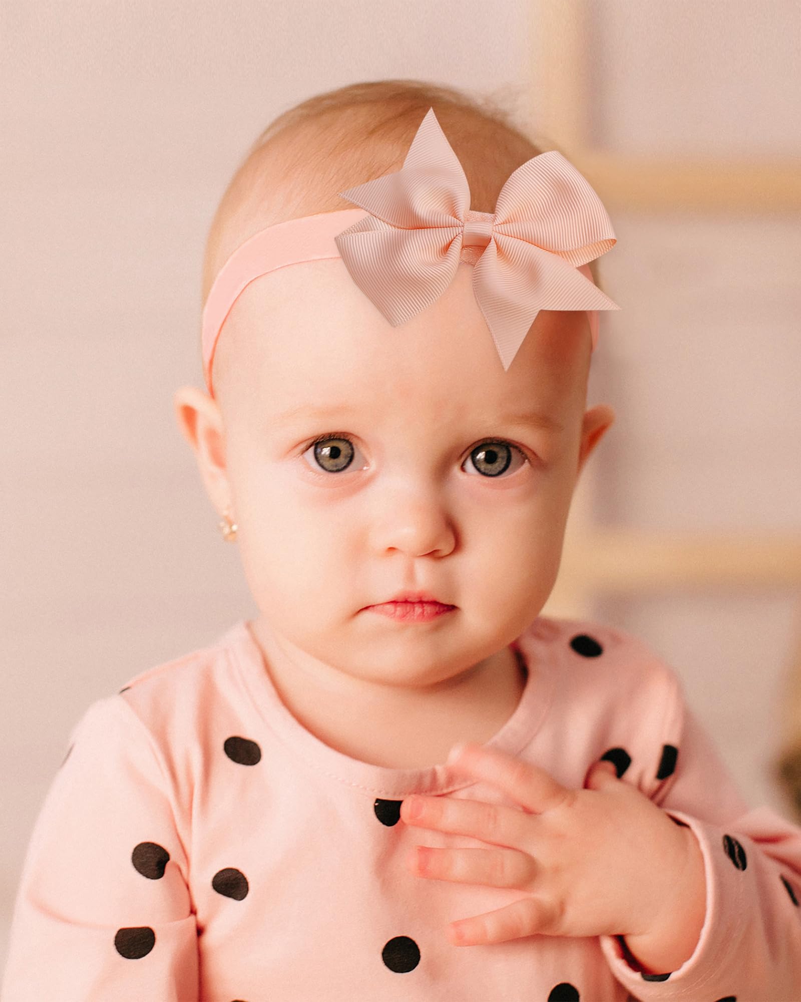 Jollybows baby headbands worn during playtime, secure yet stretchy for all ages.