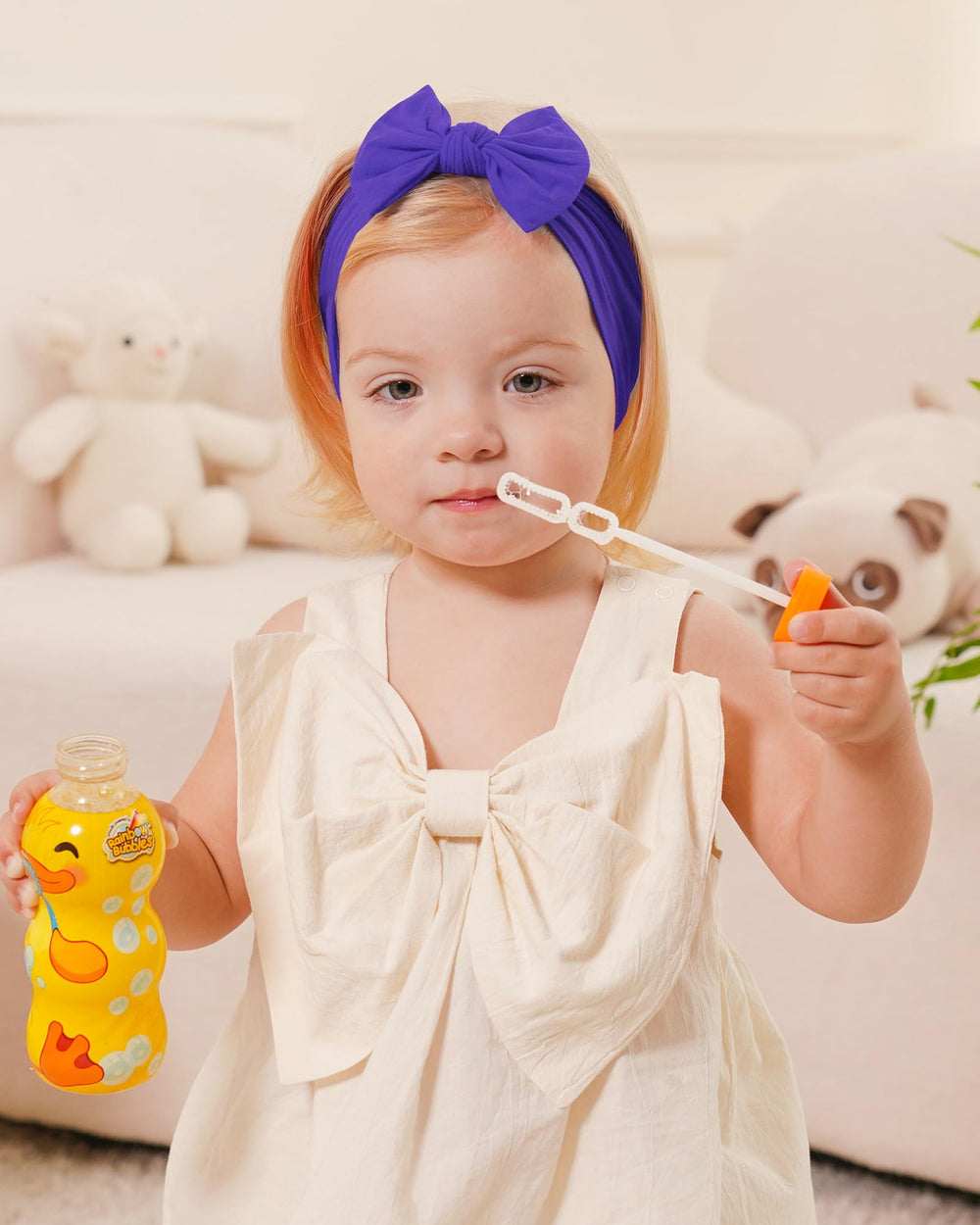 Jollybows newborn headband in white for delicate accessories.