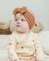 Jollybows one-size headband fits newborns to toddlers.