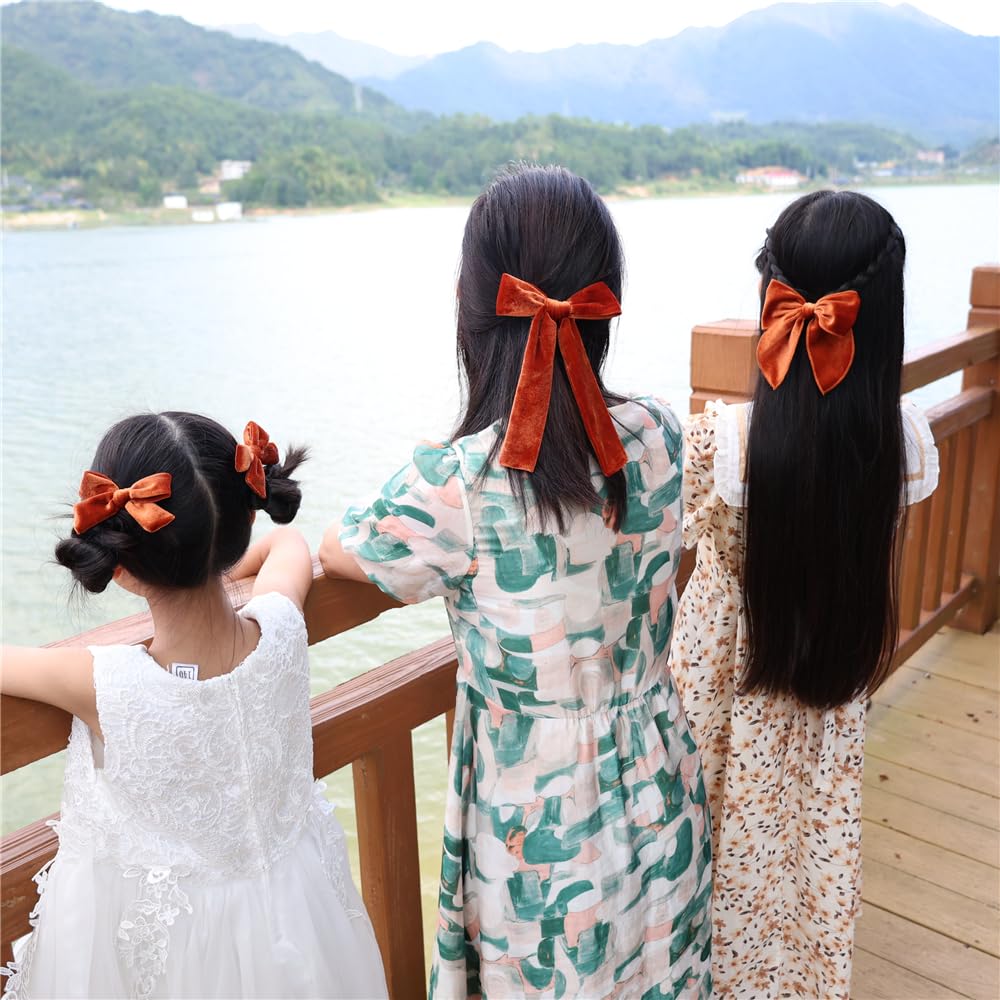 Jomila copper velvet bow worn brings festive charm to outfits.