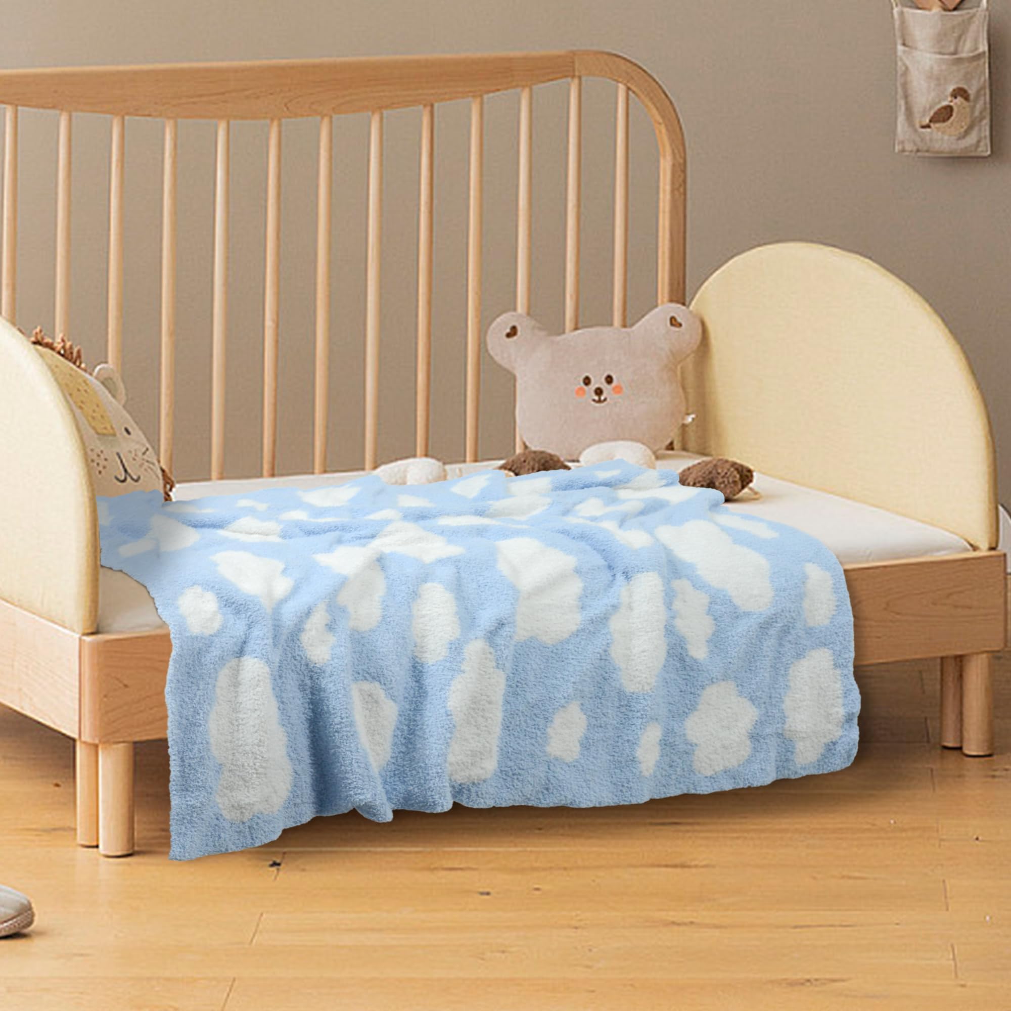 Blue cloud nursery styling with JOOJA blanket as decor and comfort.