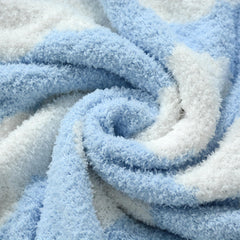 Blue cloud design on JOOJA blanket adds gentle visual stimulation.