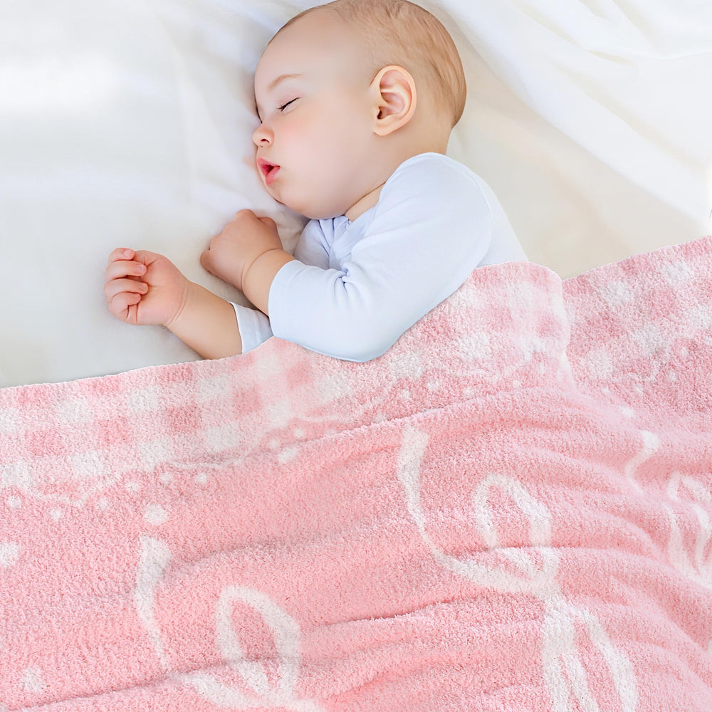 JOOJA pink bow baby blanket offers warm coverage for naps and stroller outings.