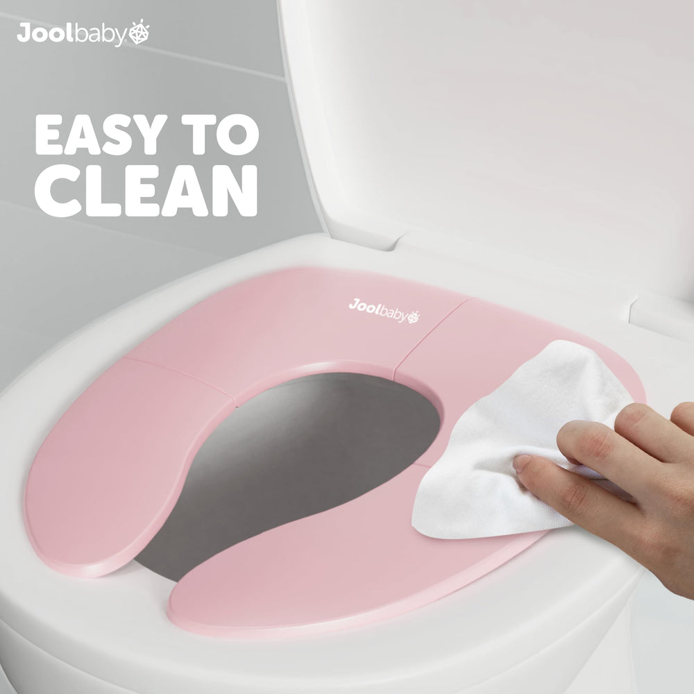 Jool Baby pink folding potty seat offers kid-friendly potty training on the go.