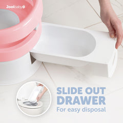Jool Baby pink lid covers the potty between uses.