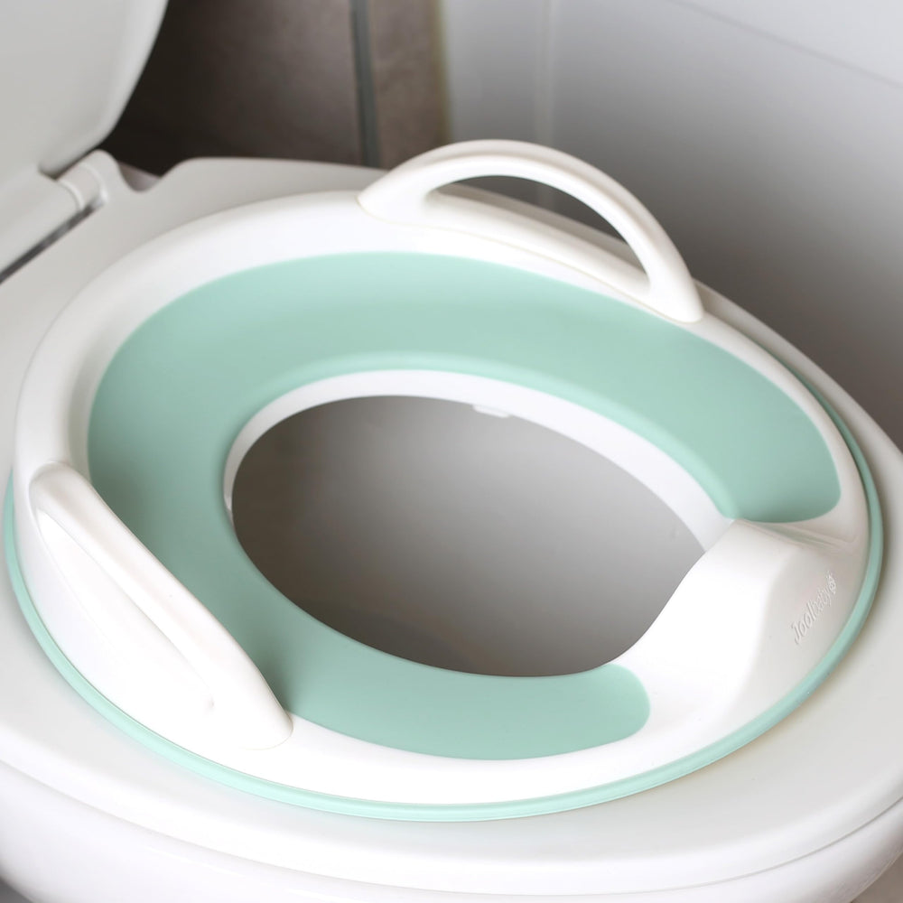 Jool Baby Potty Seat handles offer grip for confident potty training.