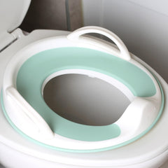 Jool Baby Potty Seat handles offer grip for confident potty training.