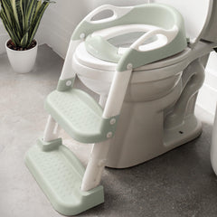 Jool Baby potty training seat with 2-step ladder in sage supports independent toilet use for toddlers.