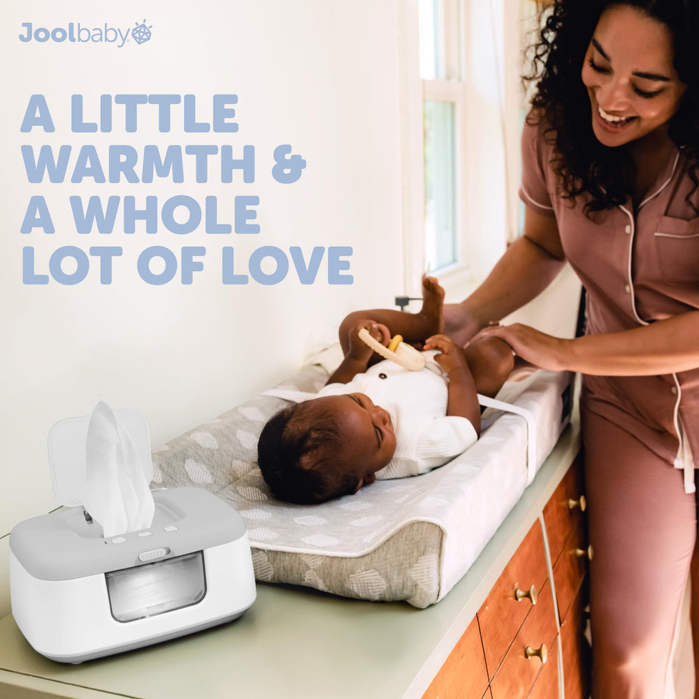 Jool Baby TinyBums wipe warmer in use during diaper changes.