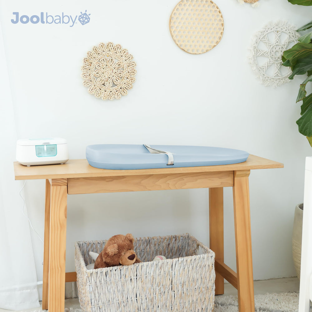 Jool Baby waterproof changing pad blue lay-flat surface for everyday use.