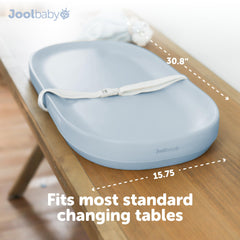 Jool Baby waterproof changing pad blue in use on a changing table.