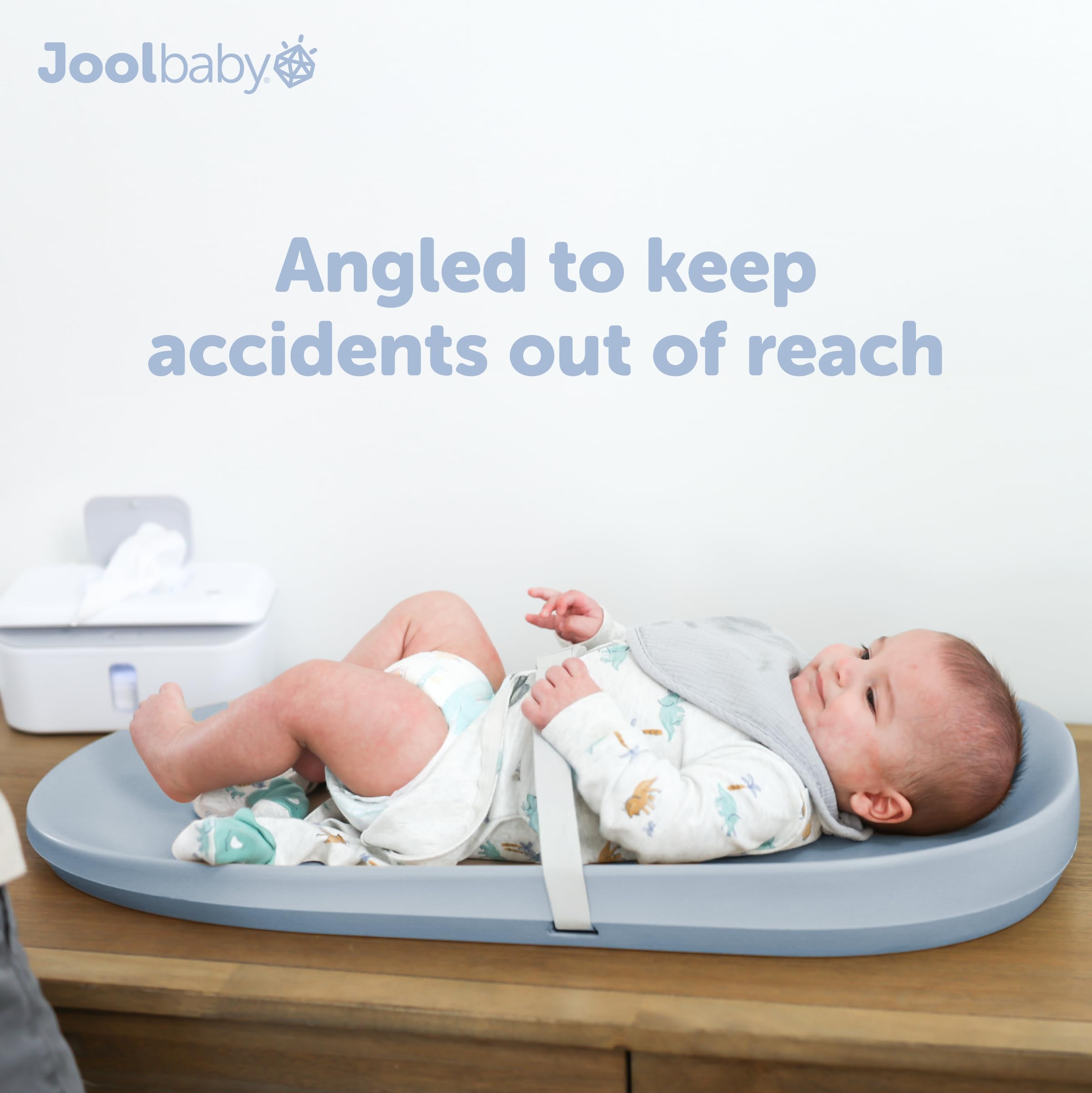 Jool Baby blue pad with safety strap for added security during changes.