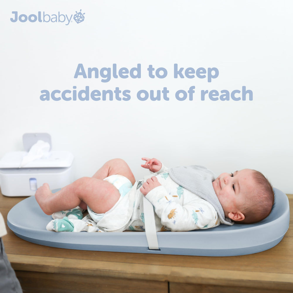 Jool Baby blue pad with safety strap for added security during changes.