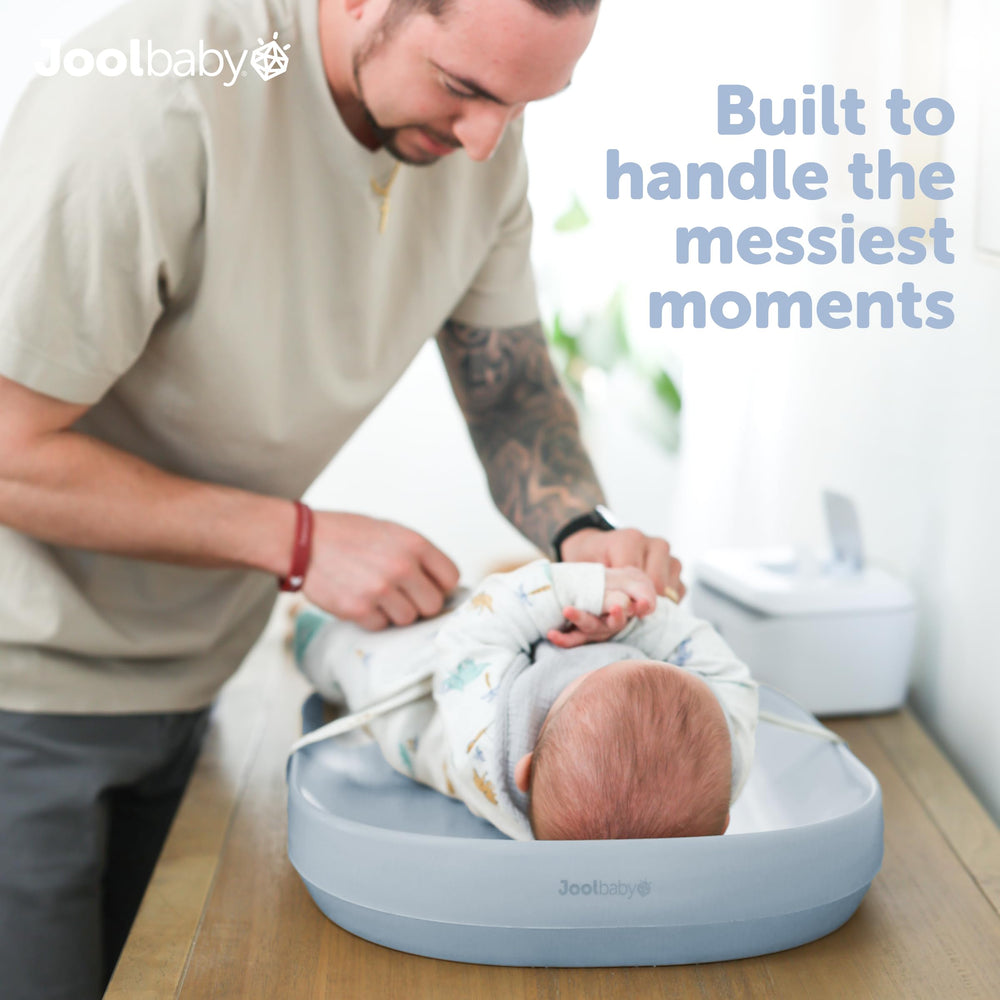 Jool Baby waterproof changing pad blue side view with raised edges for security.