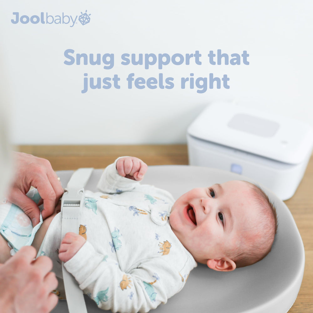 Jool Baby gray changing pad protects against messes during changes.
