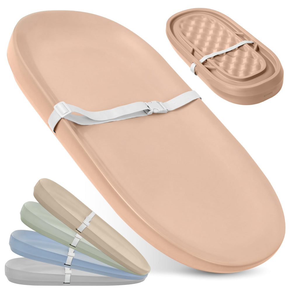 Jool Baby waterproof changing pad in peach, top view with easy wipe-clean surface.