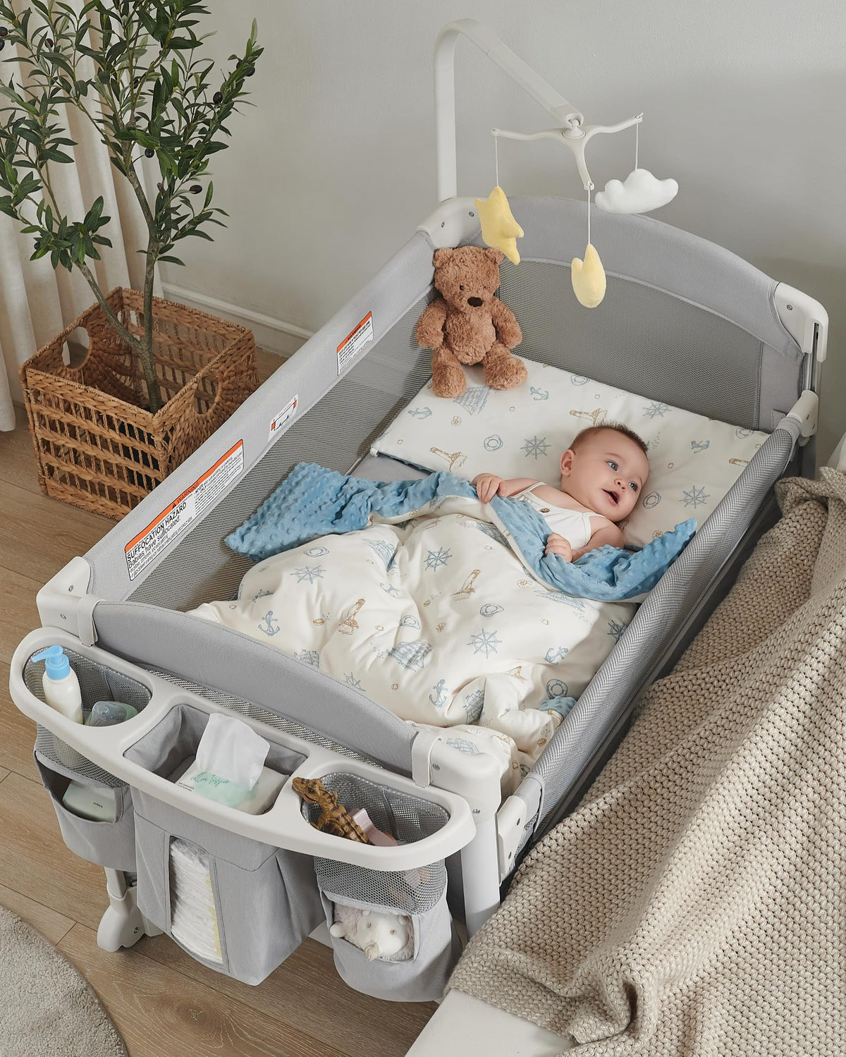 Joybai 4-in-1 bassinet beside sleeper in use, close and convenient for nighttime care.