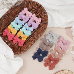 Alligator clip close-up with secure grip for delicate baby hair.