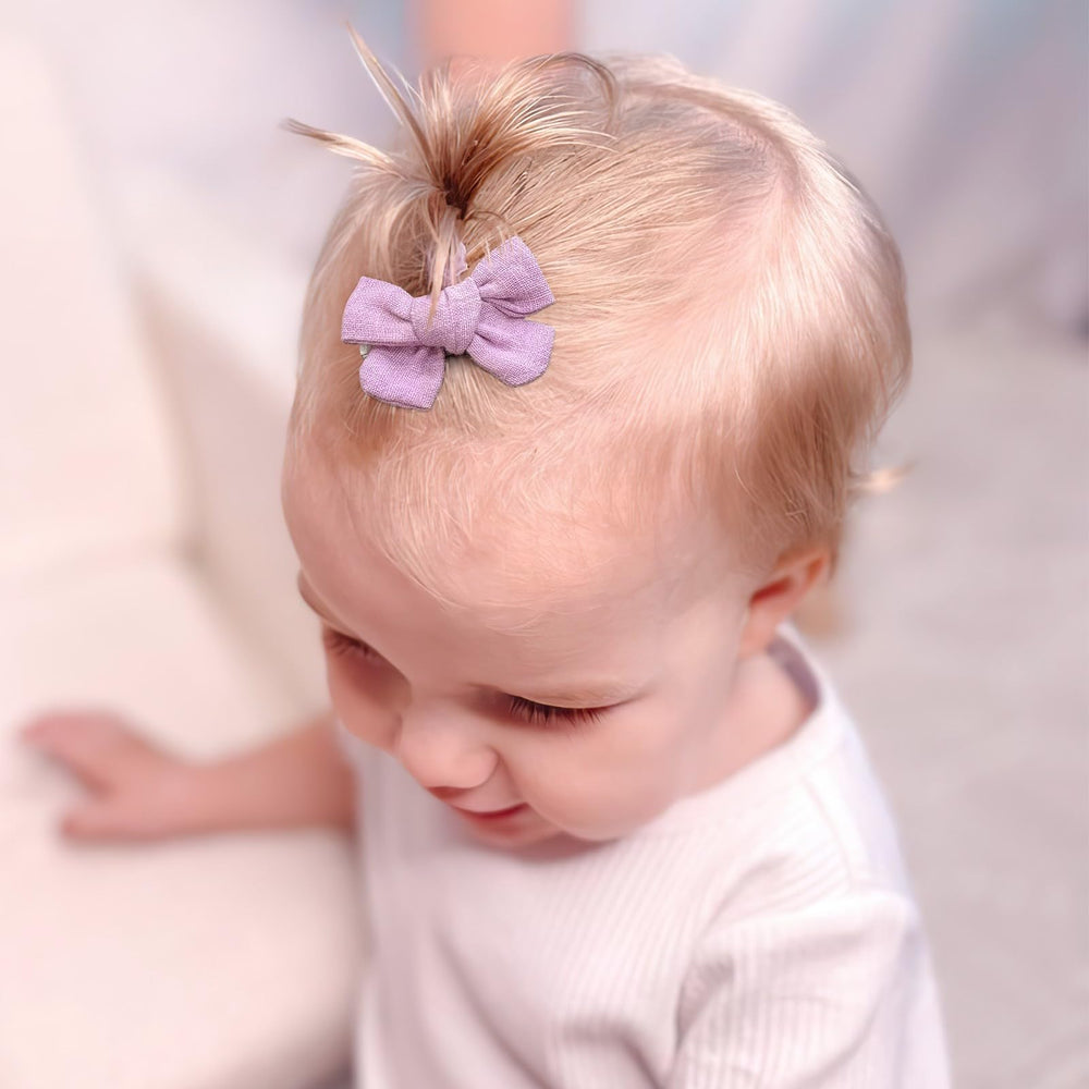 JOYOYO bow set on baby hair for everyday looks and styling.