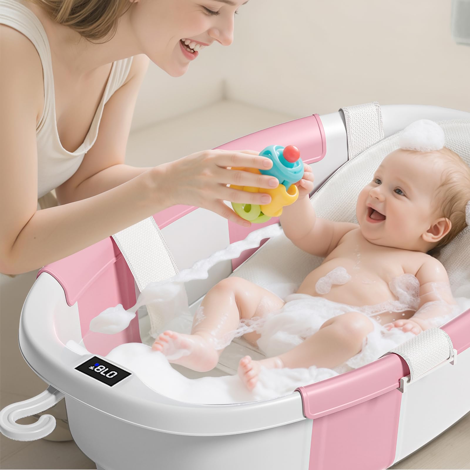 JoyYum digital thermometer displays bathwater temperature for infant comfort.