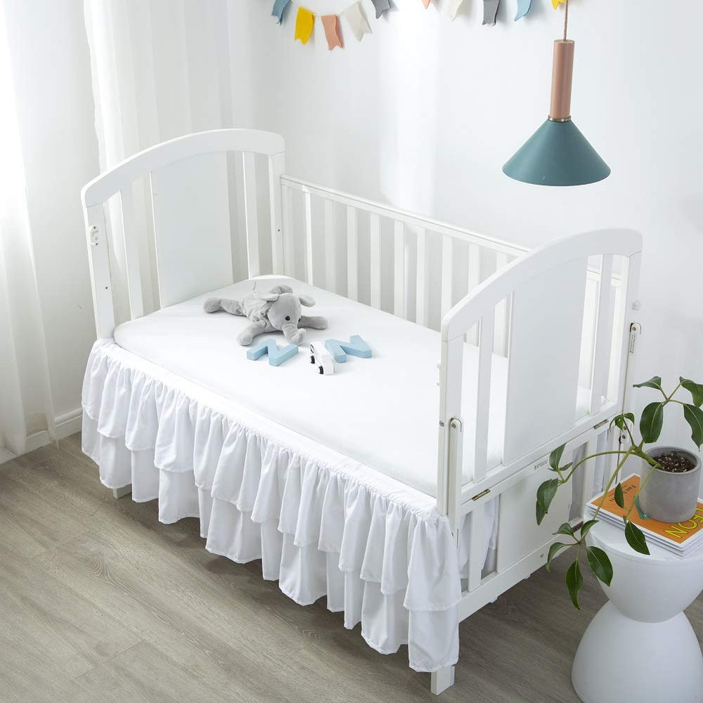 JSD crib skirt with 14-in. deep drop hides under-bed storage neatly
