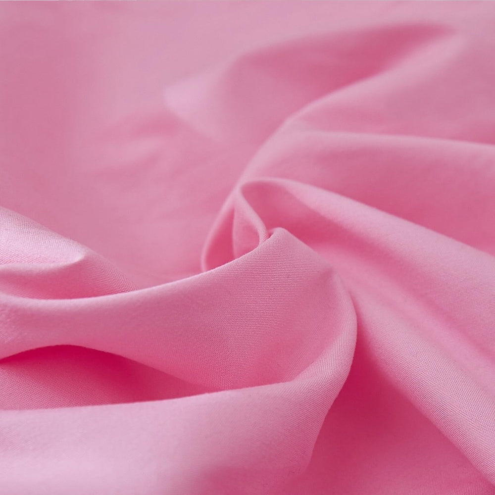 JSD pink microfiber crib skirt offers a soft, cozy feel for baby.