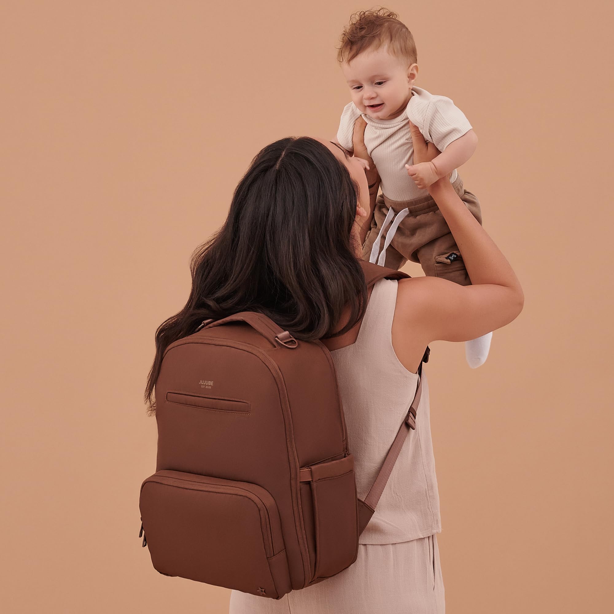 JuJuBe diaper bag interior with wipes and diaper compartments.