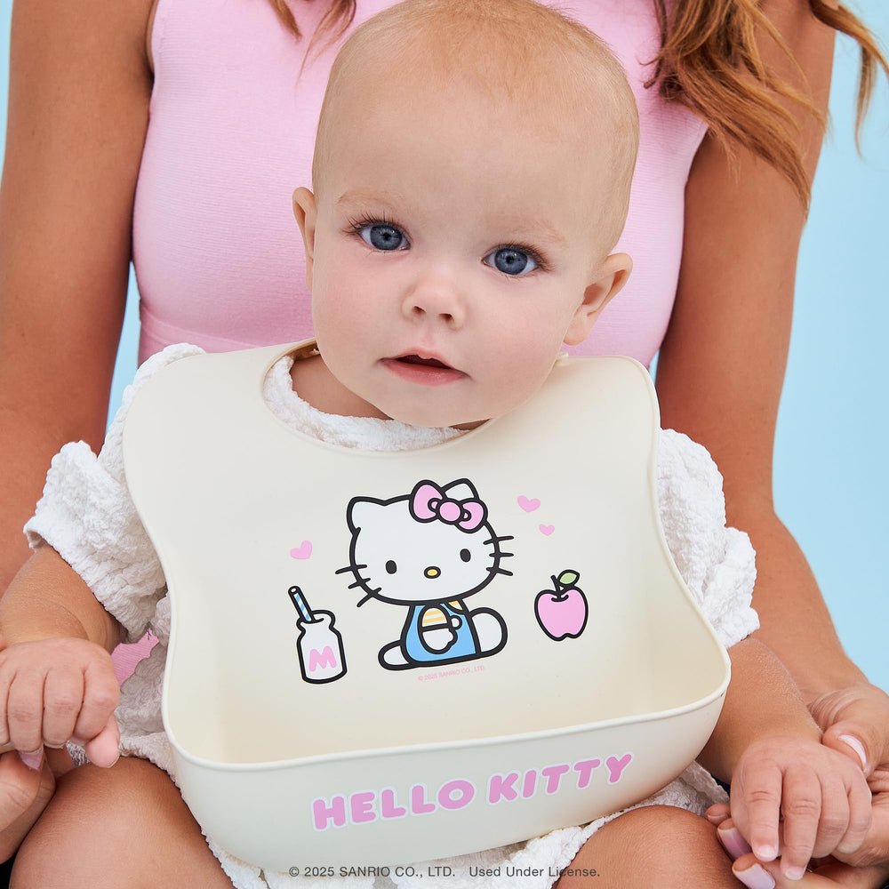 JuJuBe Hello Kitty Cherry Blossoms bib collection shot with coordinated accessories.