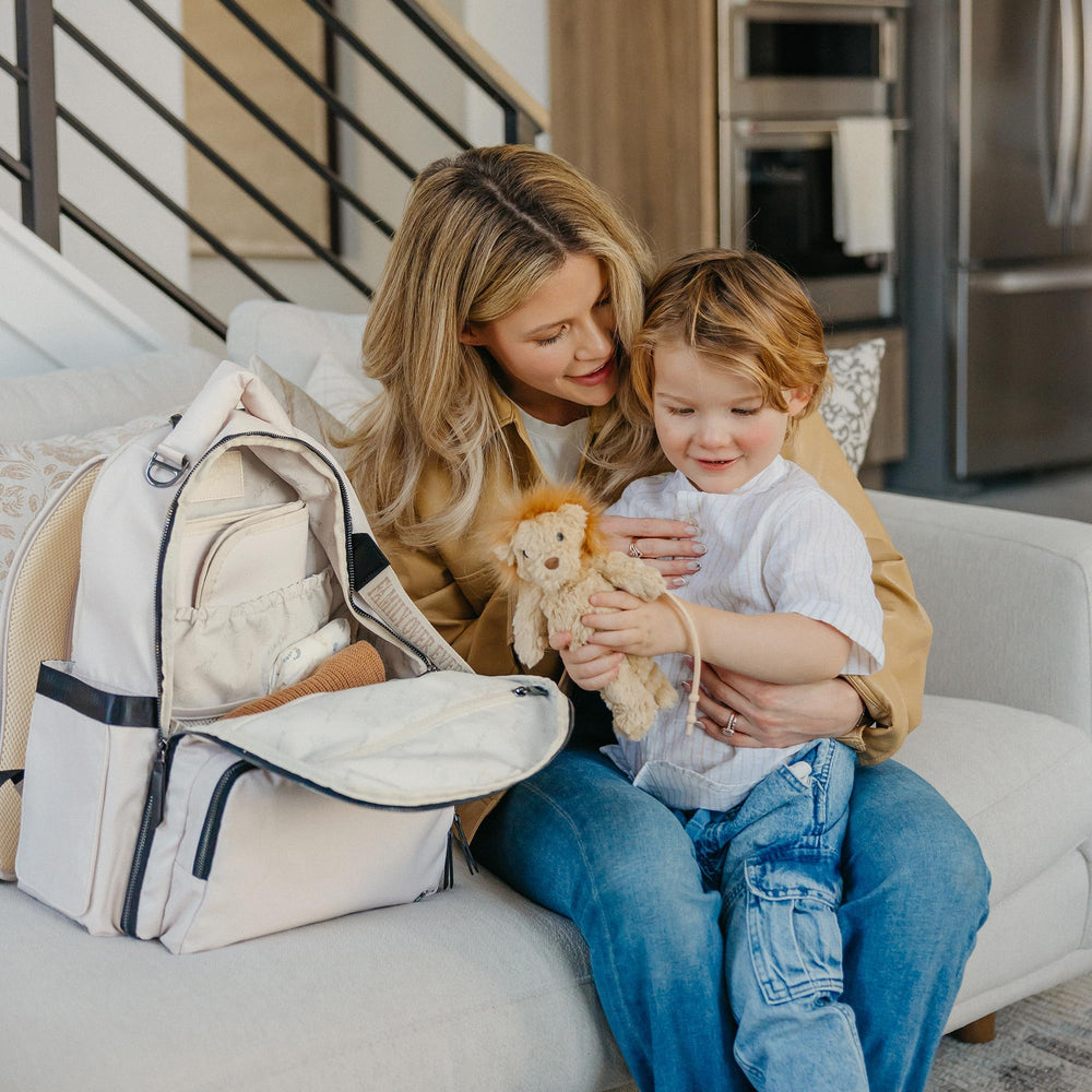JuJuBe x Witney Carson trolley strap makes airport travel smoother.