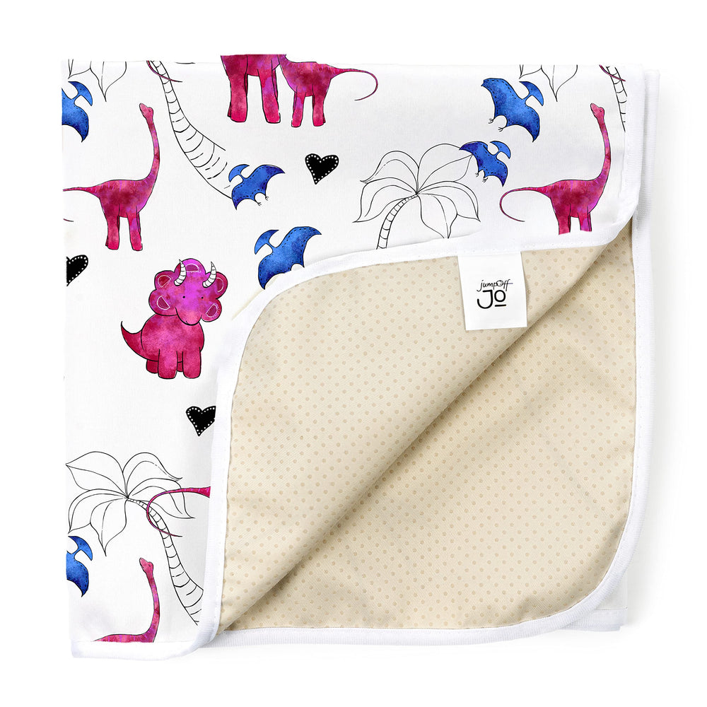 JumpOff Jo large splat mat under high chair with pink dinosaur design protects floors from spills.