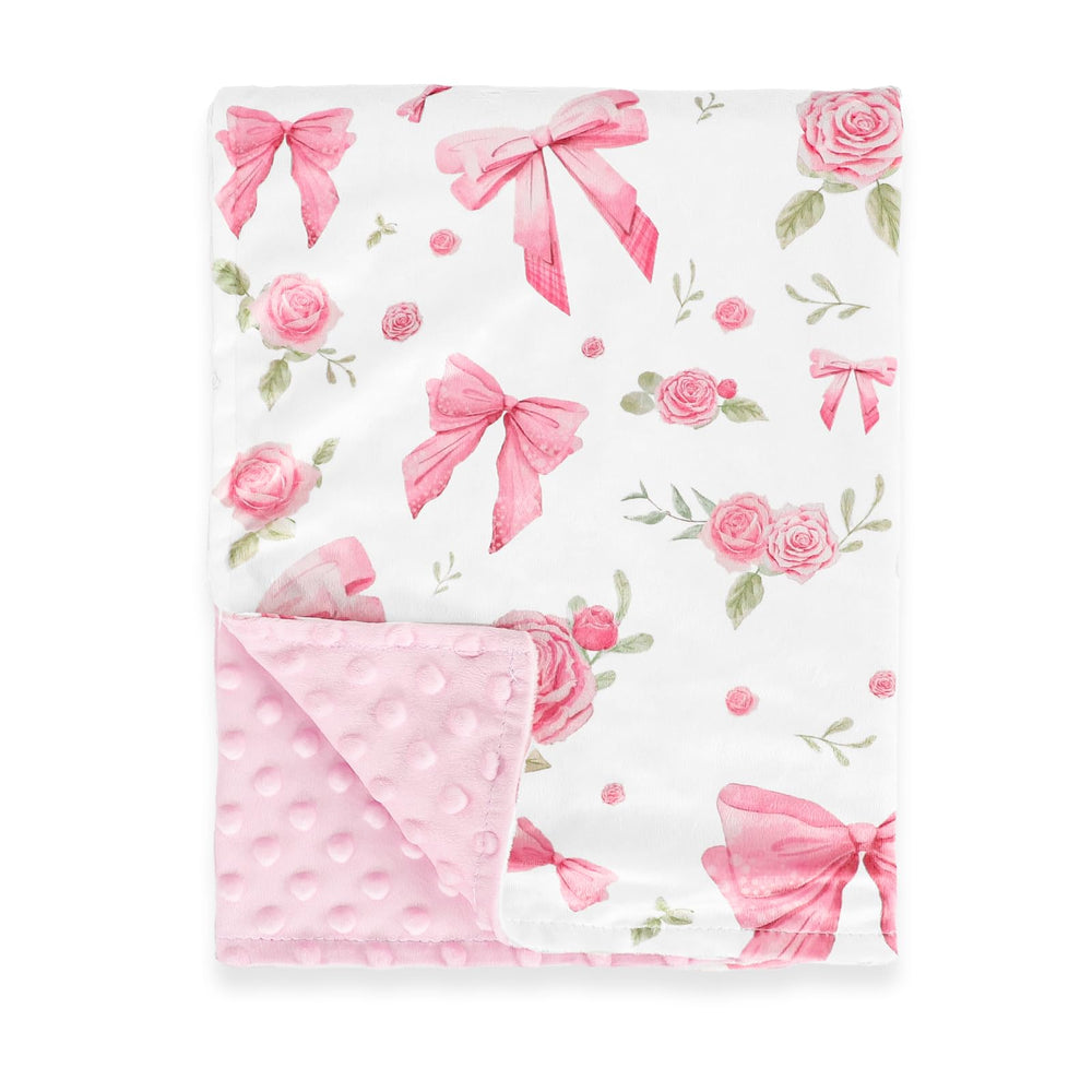 Jundetye baby blanket with pink rose design keeps baby cozy during naps.
