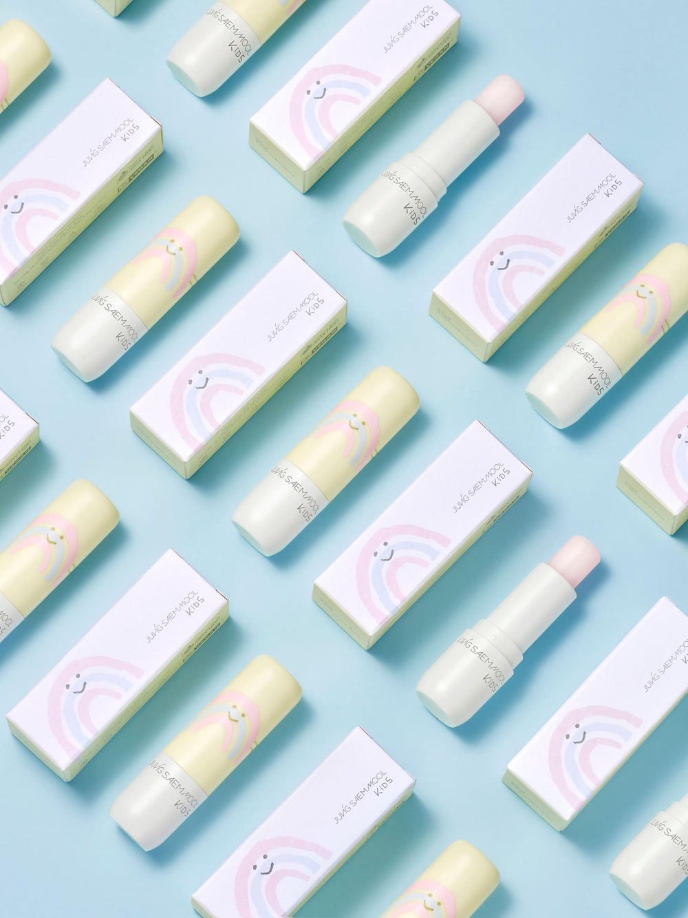 JUNG SAEM MOOL KIDS compact lip balm resting in hand for travel.
