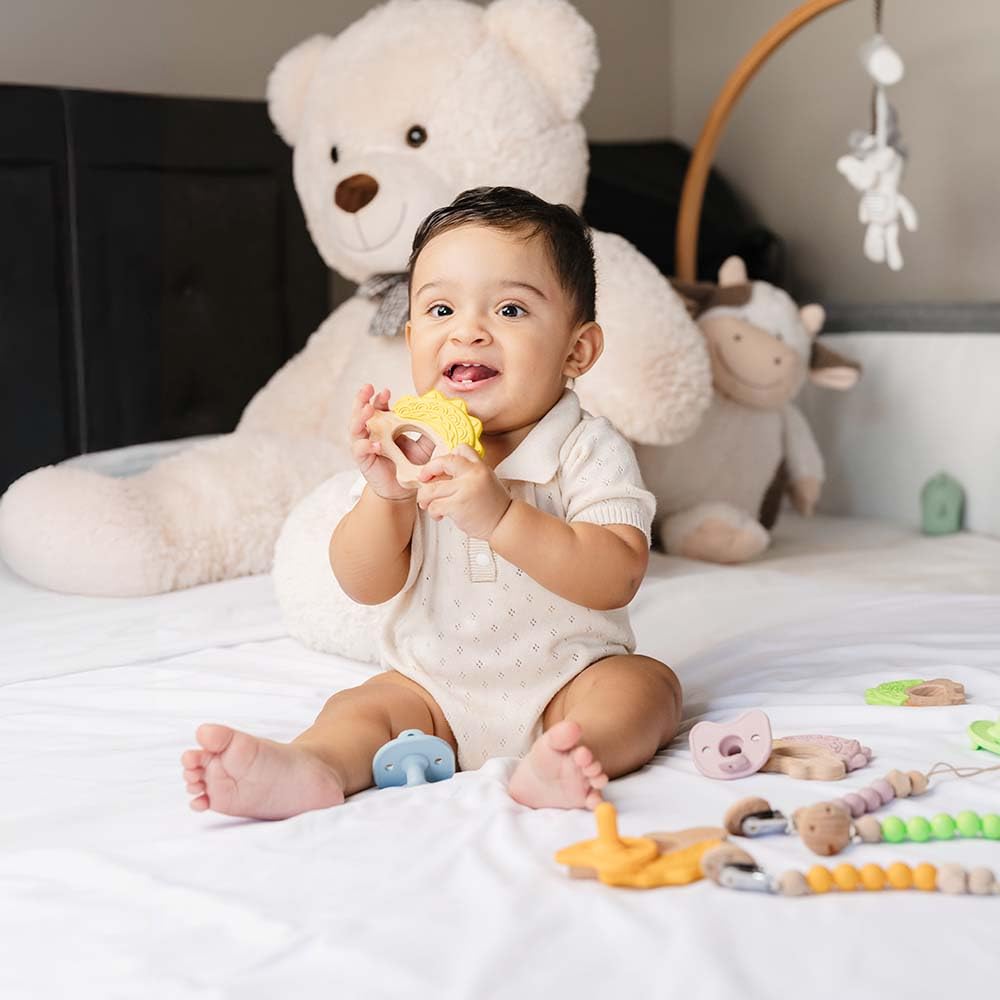 JUNUNA soft silicone teether protects sore gums with gentle chewable texture.
